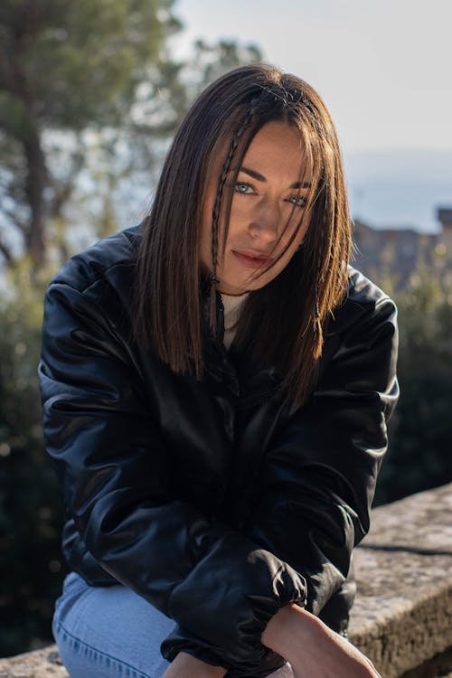 Pensive Woman Wearing Leather Jacket 