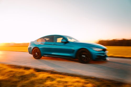 Free A Car Driving on a Road  Stock Photo