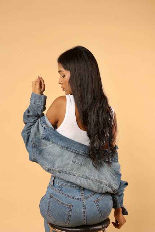 Back View of a Young Woman in a Denim Outfit 
