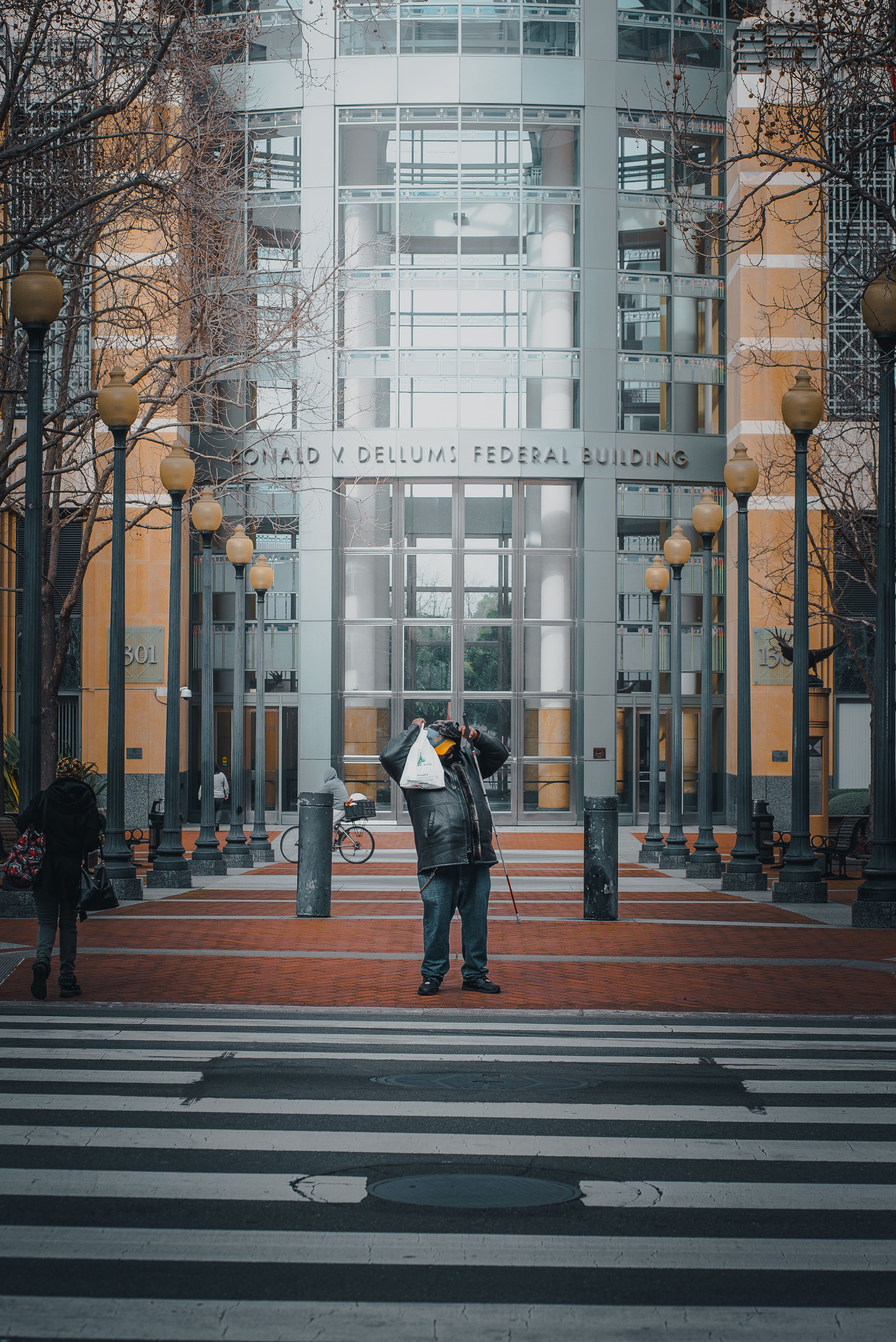 A person standing in the middle of a crosswalk · Free Stock Photo