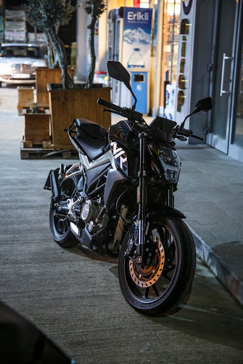 A Motorcycle Parked on the Street in City 