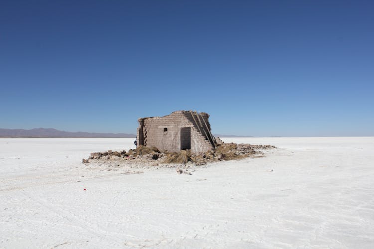 House Ruins In Desert Landscape