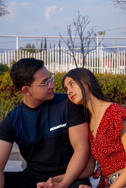 Couple Sitting and Holding Hands