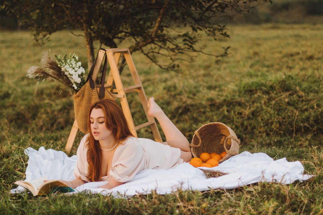 The Allure of Dating Ukrainian Women 1 free photo of woman in white dress on picnic on meadow
