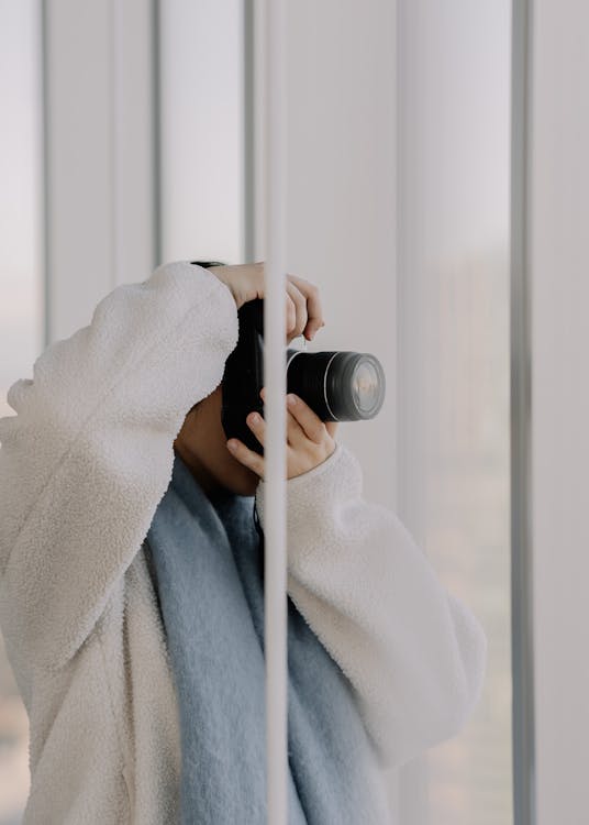 woman-taking-a-picture-with-a-camera