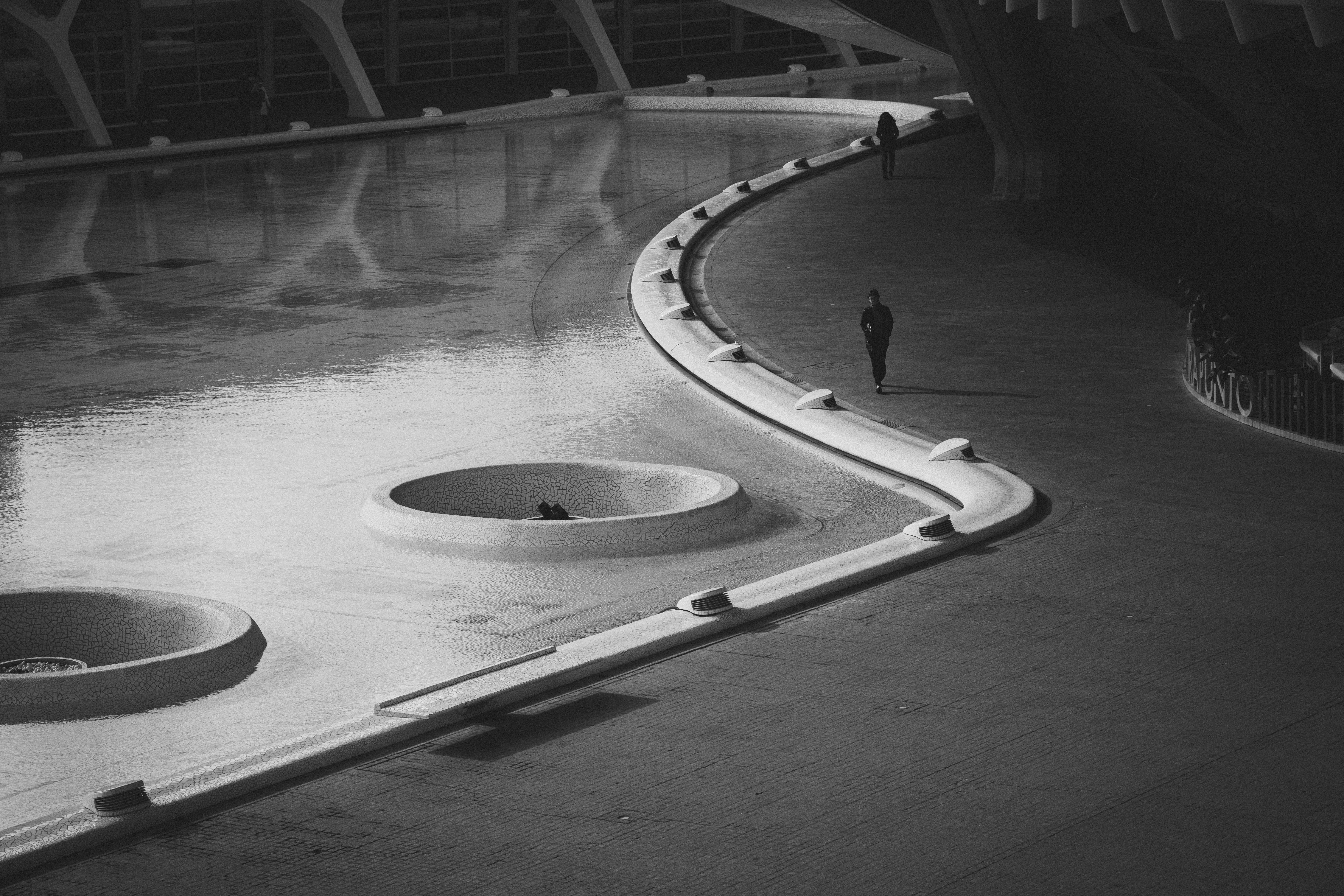 Monochrome view of a promenade in Valencia with urban design.