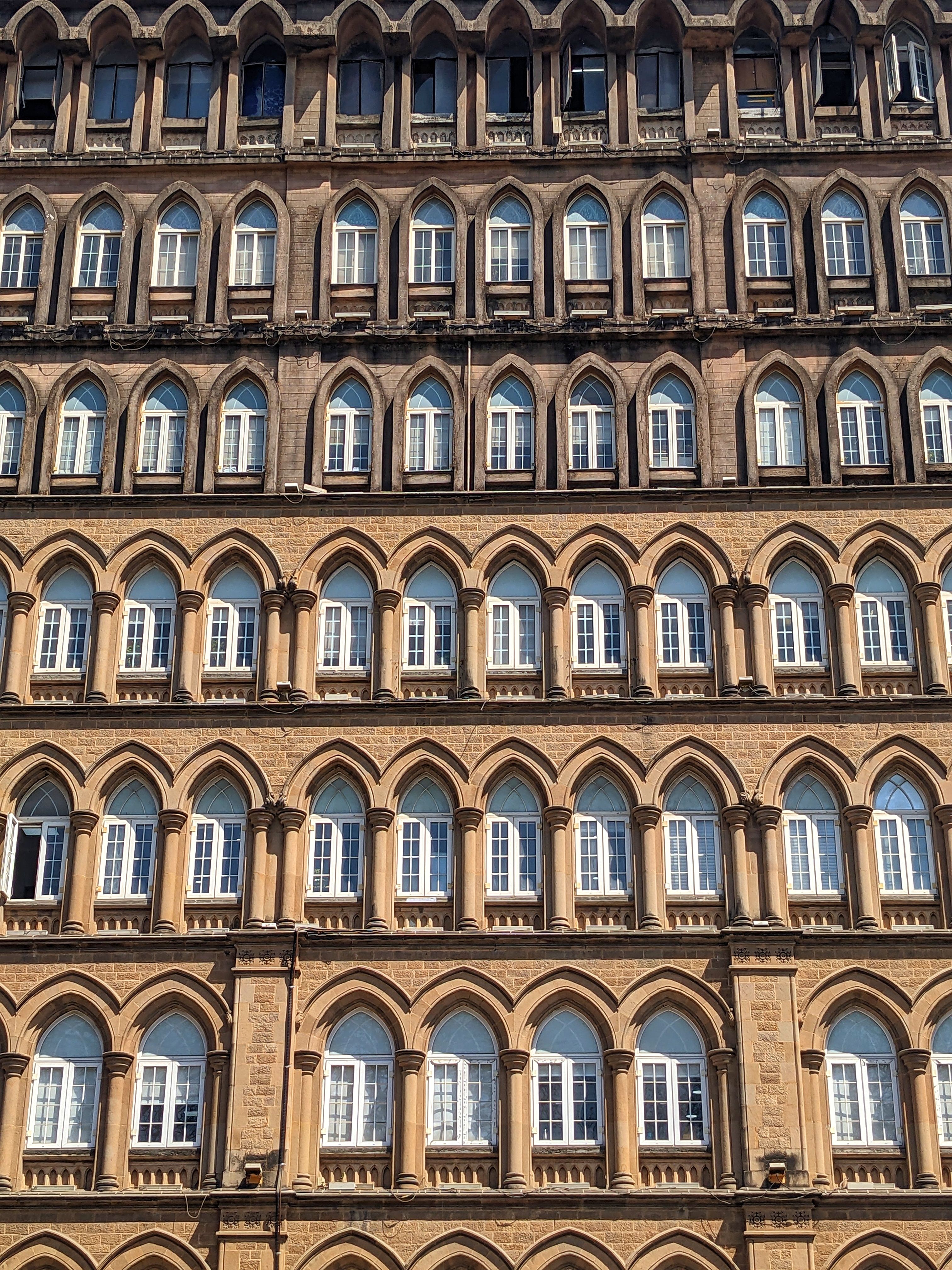 Low Angle Shot of a Traditional Building Facade · Free Stock Photo