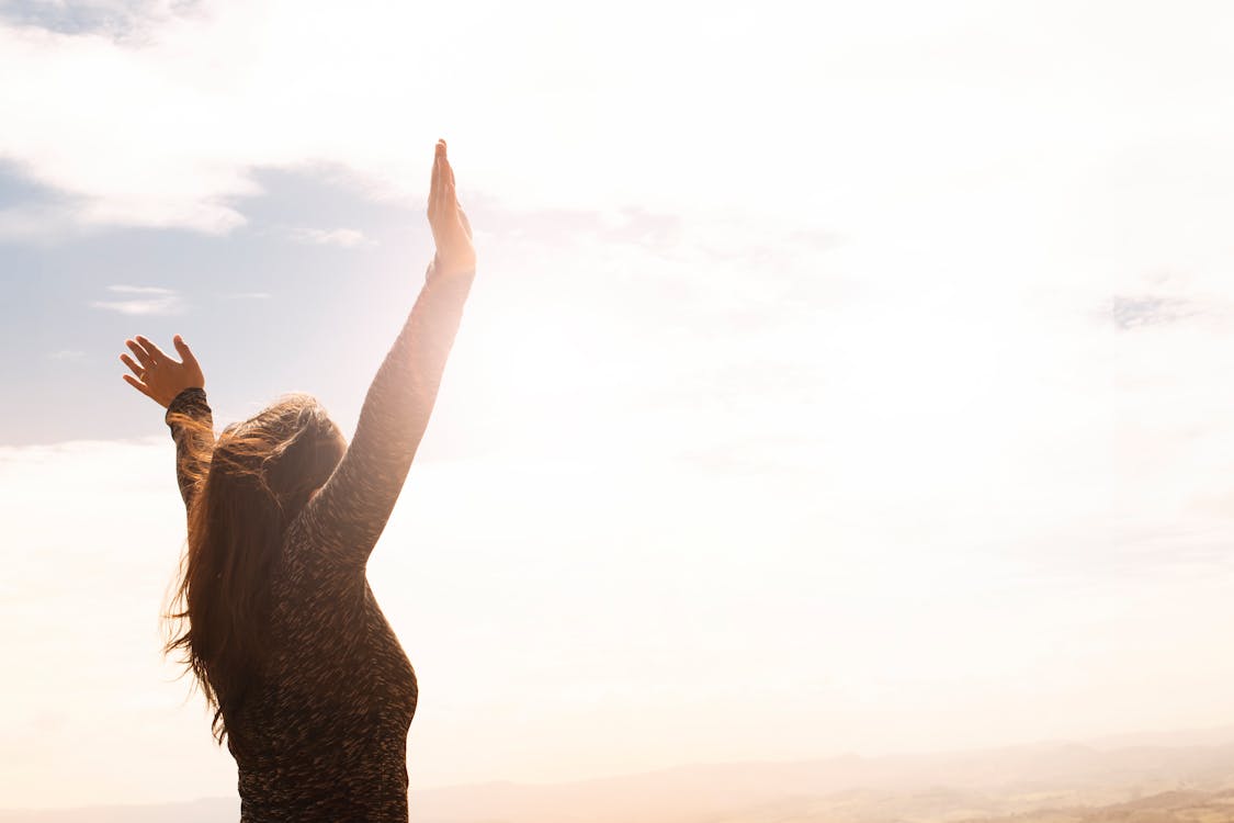 Free Photo of Woman Raising Both Hands Stock Photo