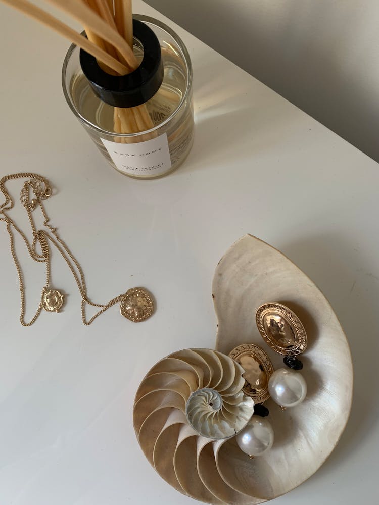 Jewelry On Table And In Shell