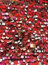 Assorted-color-shaped Padlocks Hanging on Grey Metal