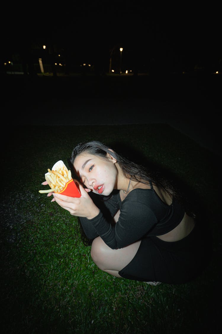 Woman Holding French Fries 