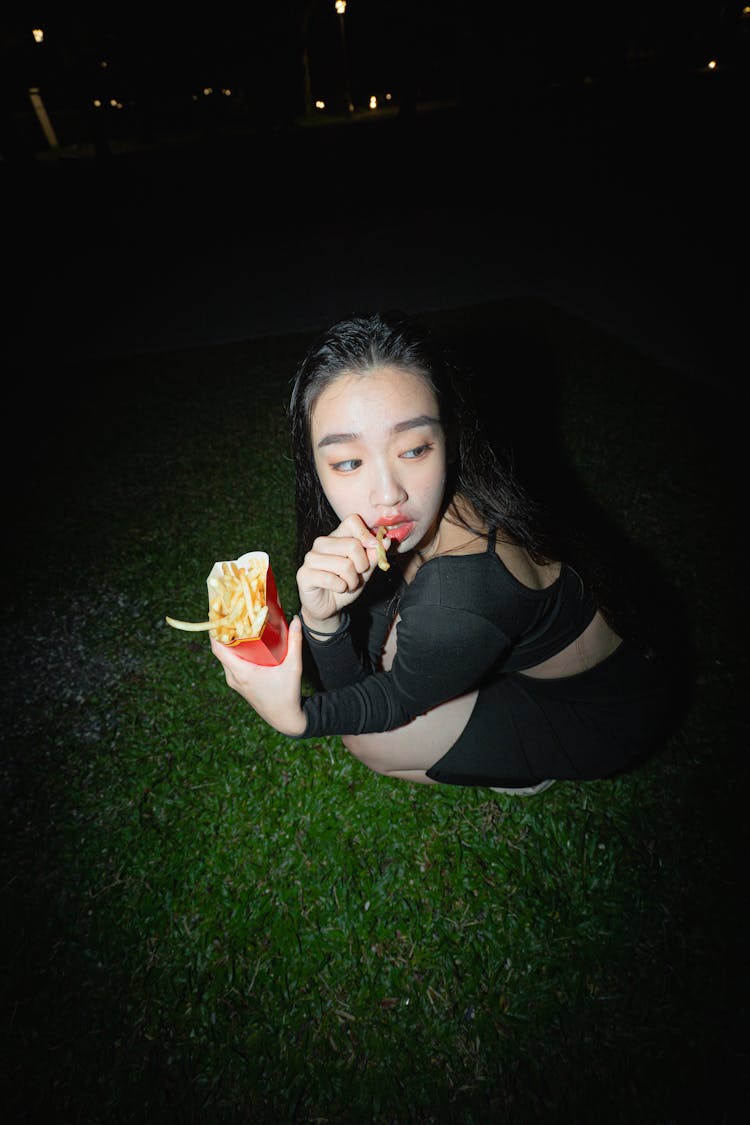 Woman Eating French Fries 