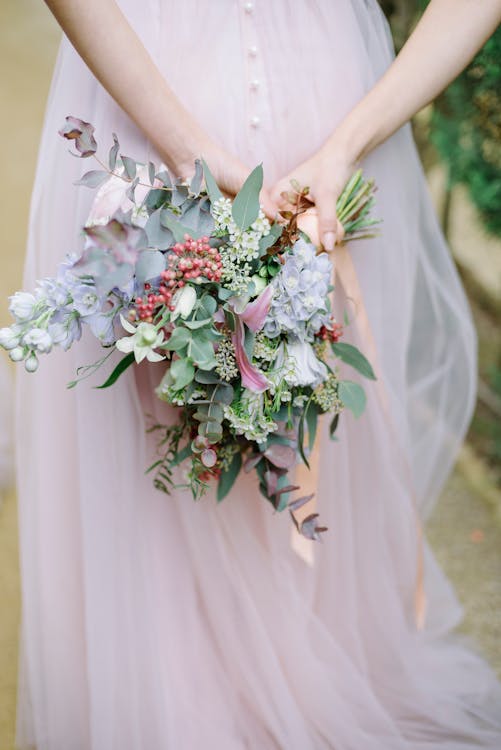 Woman in Gown Holding Bouquet