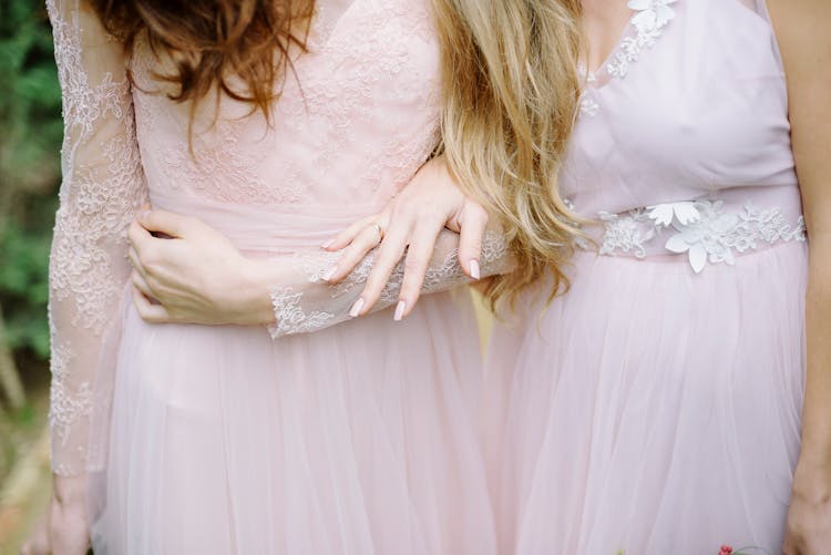 Close-up Of Bridesmaids In Dresses In Nature