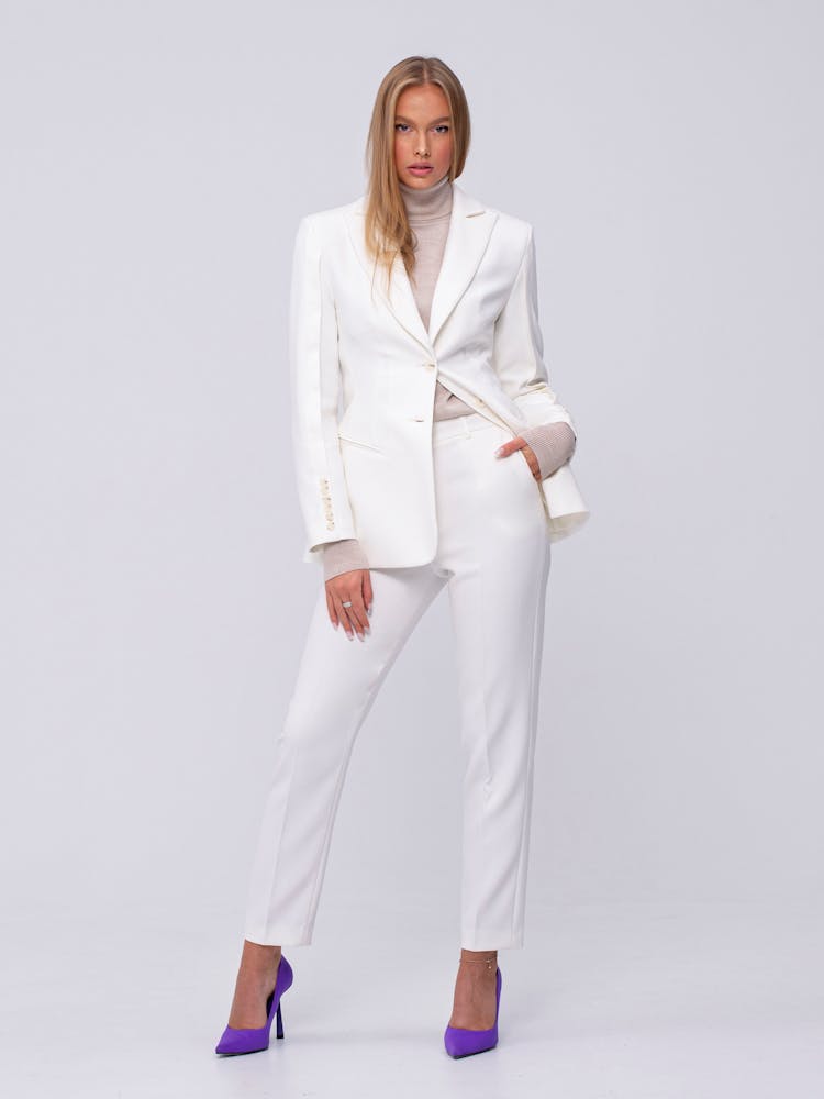 Woman Wearing A White Suit 