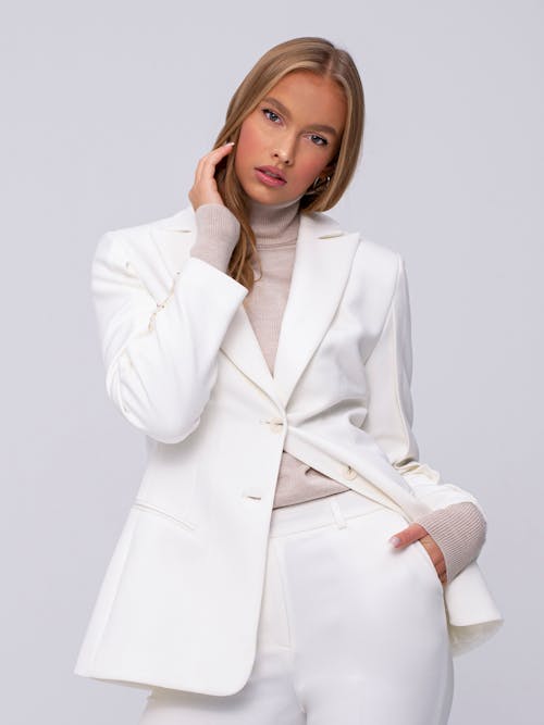 Portrait of a Woman Wearing a White Suit 