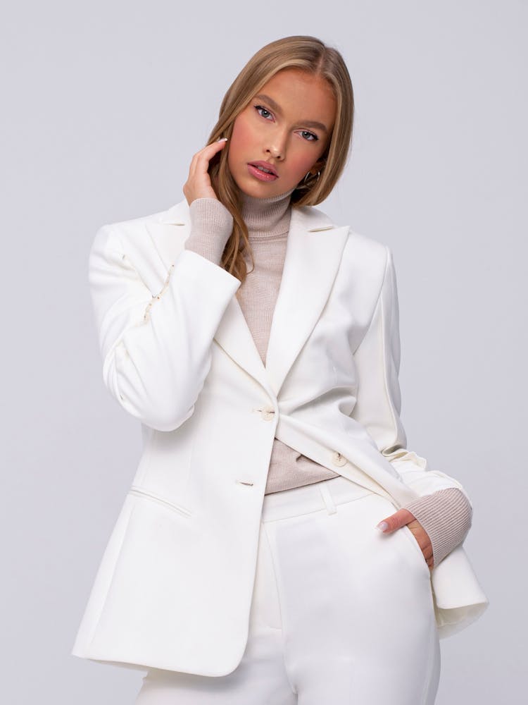 Portrait Of A Woman Wearing A White Suit 