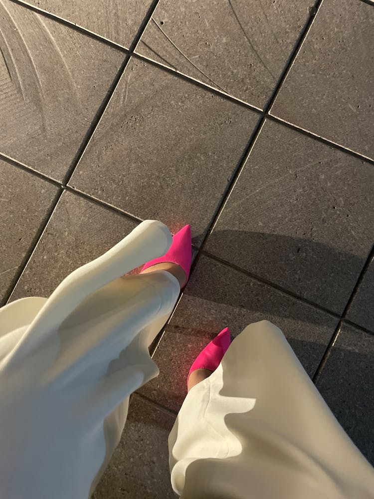 Woman In Elegant Trousers And Pink High Heels