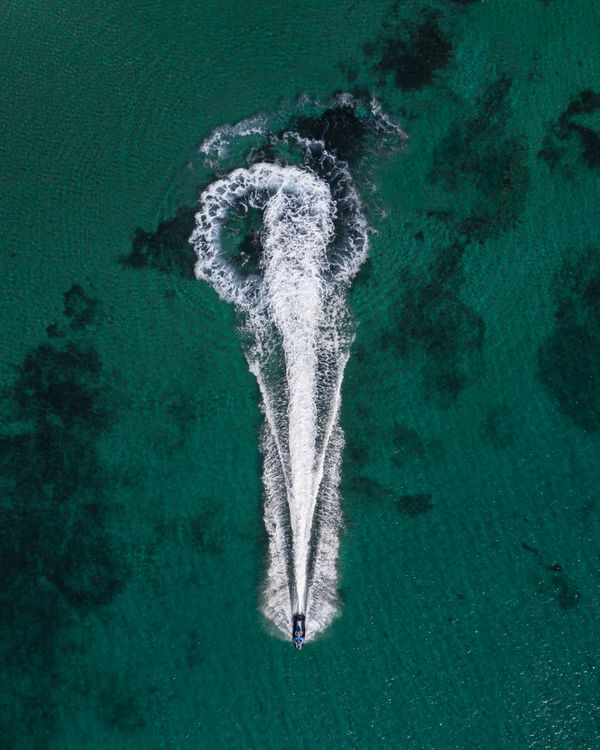 Aerial Photo Of Boat On Body Of Water · Free Stock Photo