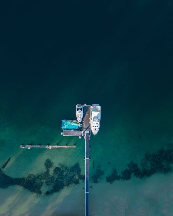 Three Powerboats Beside Sea Dock