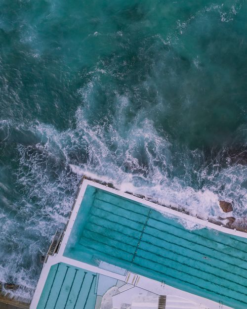 Free A breathtaking aerial view of the famous Bondi Beach pool meeting ocean waves in Australia. Stock Photo
