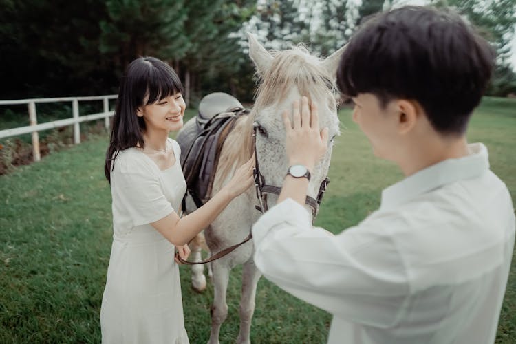 Beautiful Woman And Man With Horse