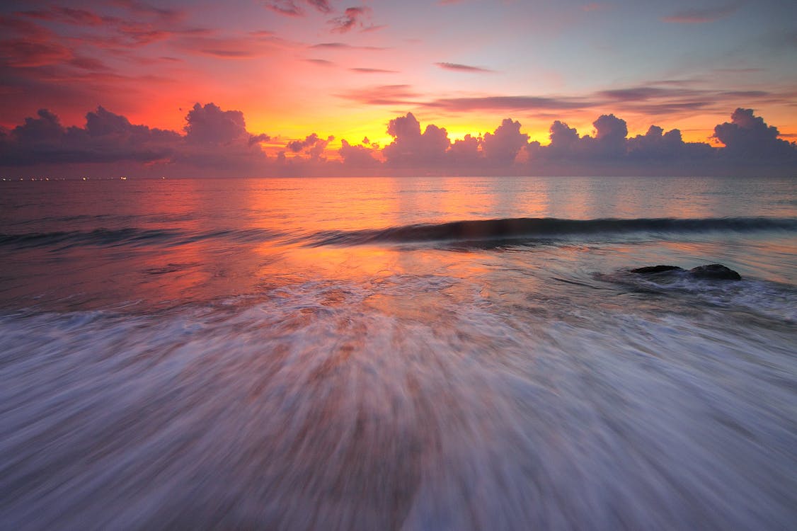 Ücretsiz Günbatımı Sırasında Okyanus Stok Fotoğraflar