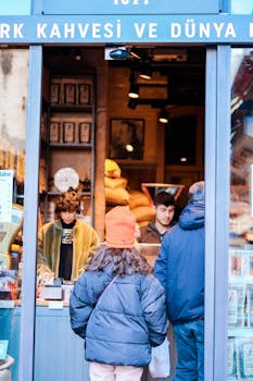 A busy Istanbul coffee shop with people interacting and buying goods.