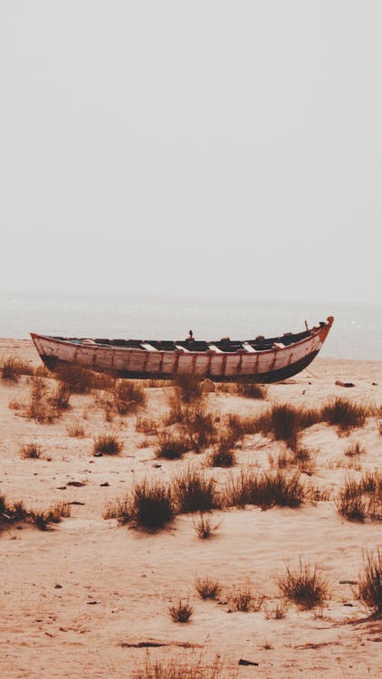 Wooden Boat on an Empty Beach 