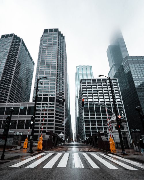 Free Stunning view of a foggy urban downtown with towering skyscrapers and a bridge, capturing the essence of modern city life. Stock Photo
