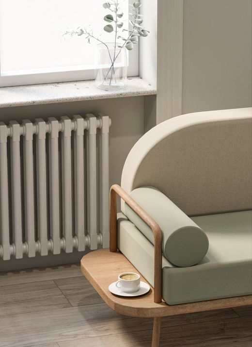 Sage upholstered chair with a side table — photo by Muharrem Alper on Pexels