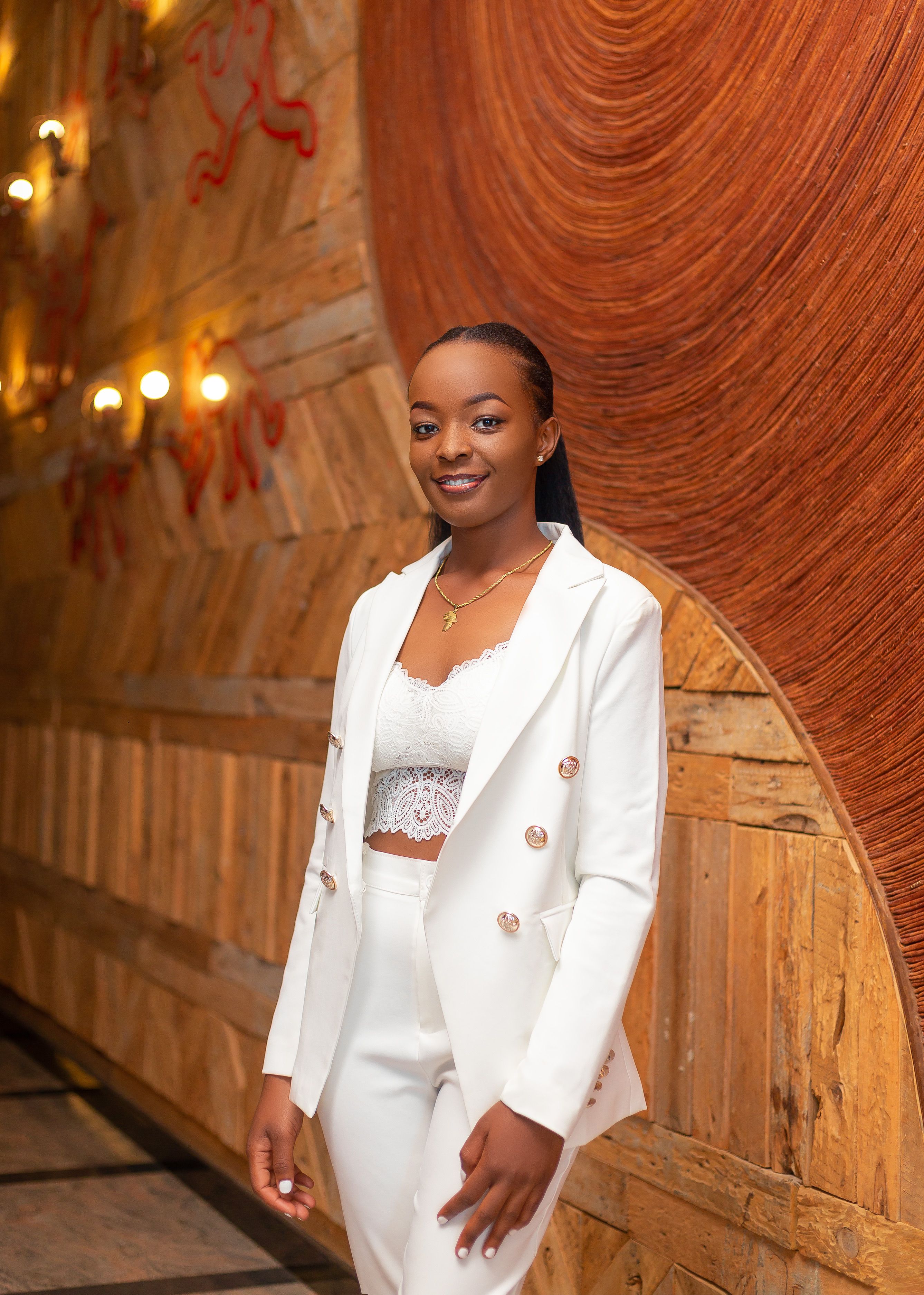 Woman Posing in White Suit · Free Stock Photo