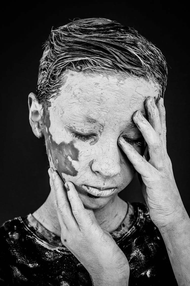 Boy With Paint Stains On Face