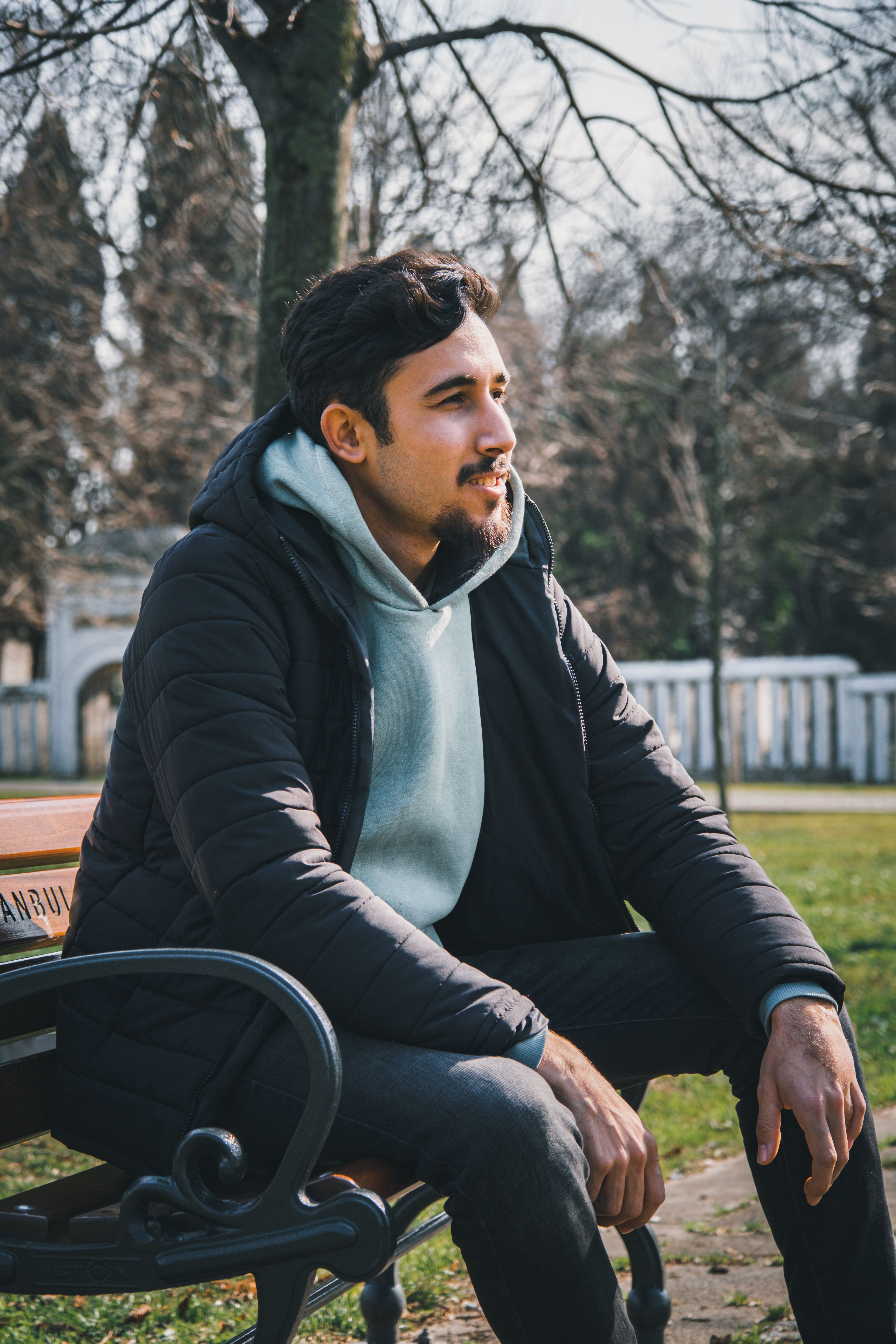 Man Sitting on a Bench in a Park · Free Stock Photo