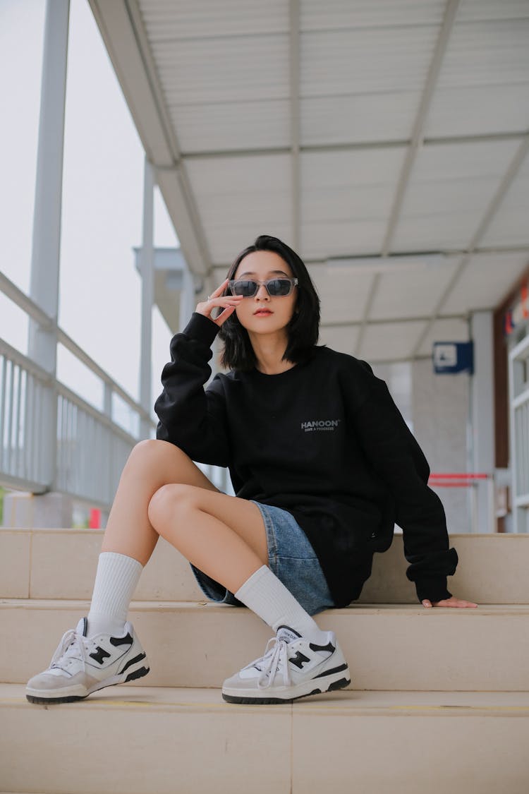 Woman Sitting On Stairs