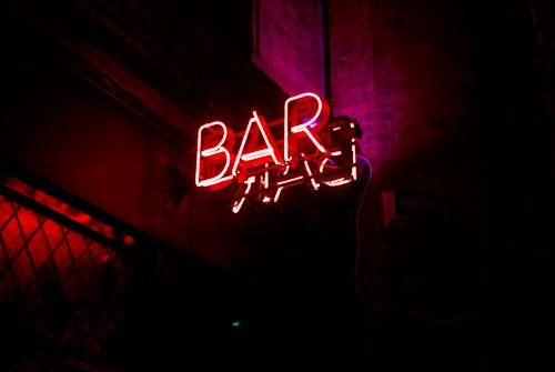 Free A Neon Sign above a Bar  Stock Photo