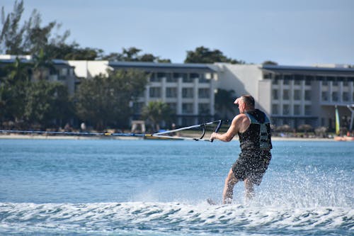 Photo of a Man Surfing