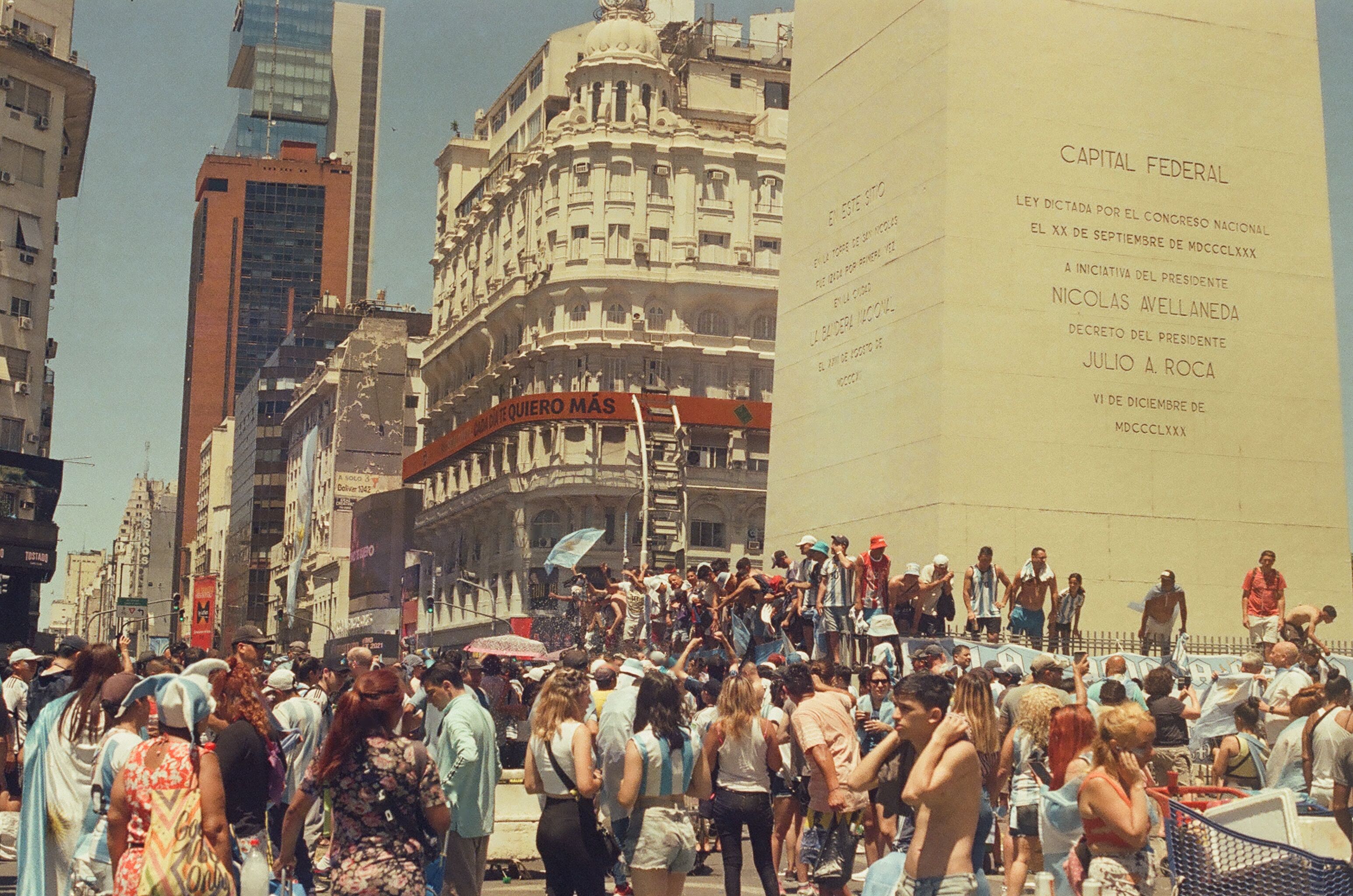 Crowd on City Street Between Buildings · Free Stock Photo