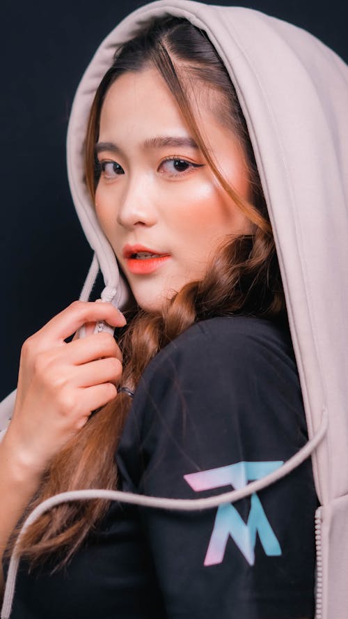 Studio Shoot of a Woman with Braided Hair Wearing a Hood