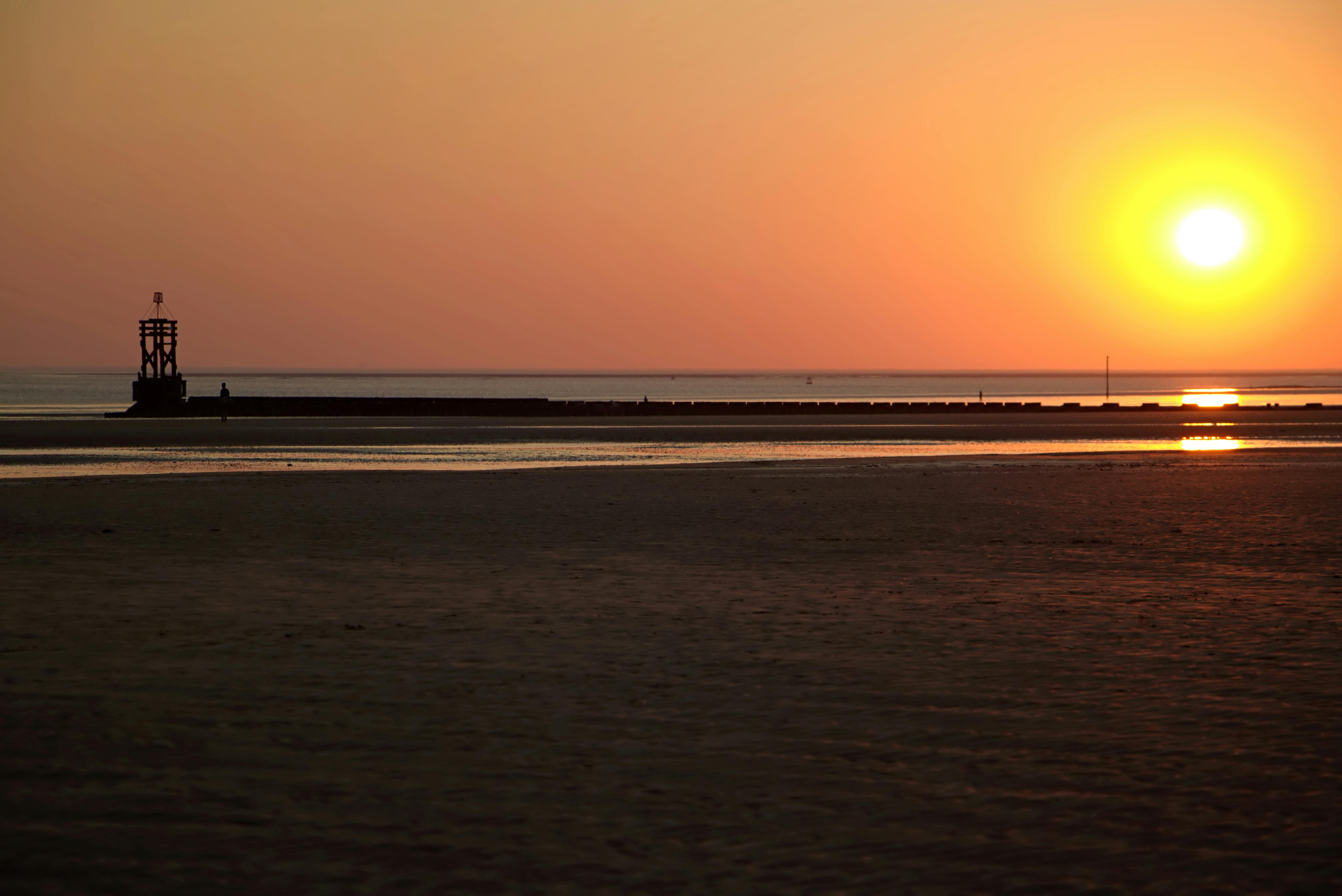Gambar Matahari Terbenam Di Tepi Laut AR Production