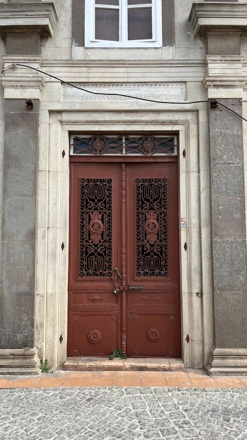 Free Old Wooden Door in a Traditional Building  Stock Photo