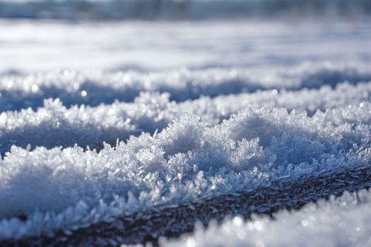 Macro shot of frosty snow crystals in winter, Warsaw, Poland.