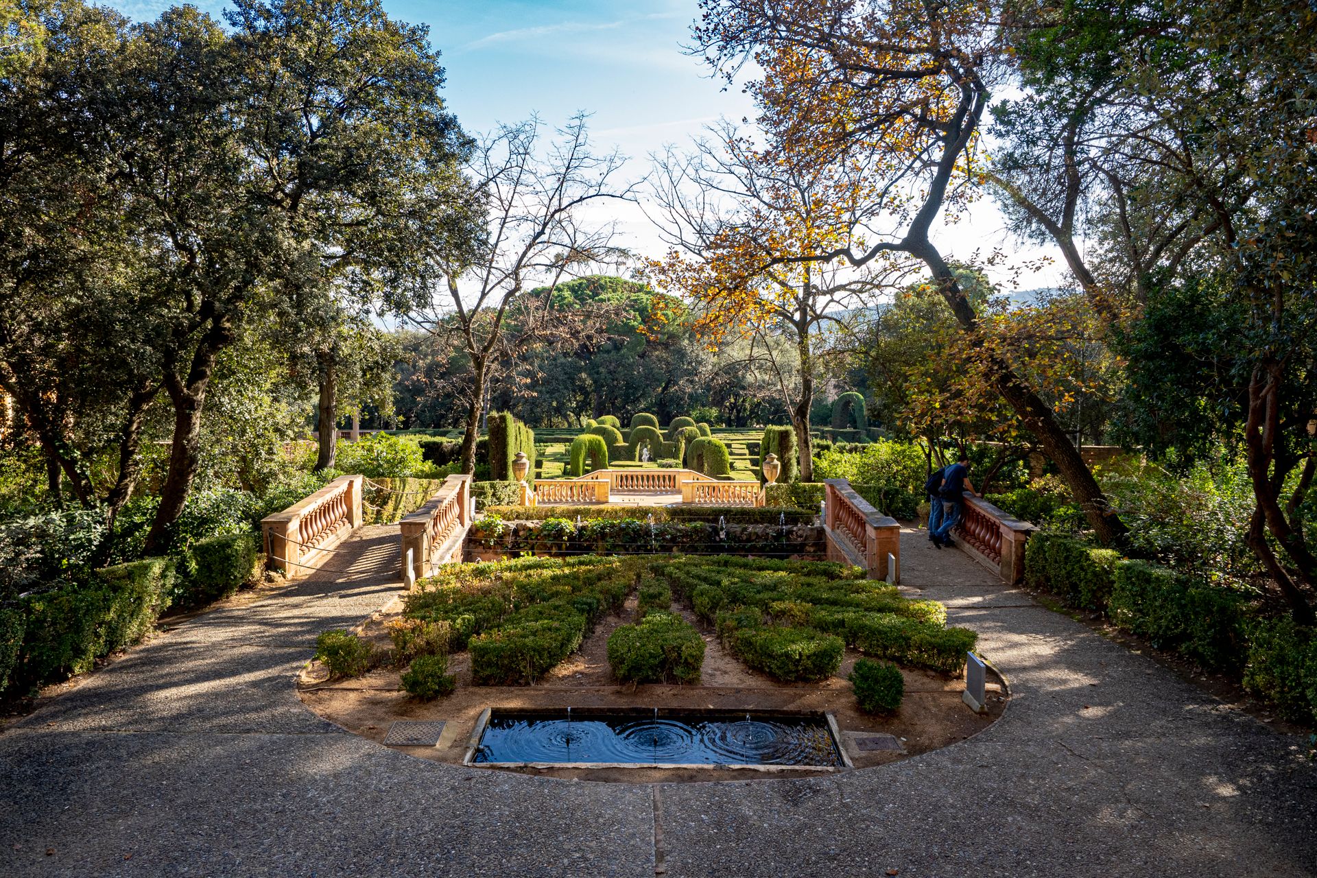 Explore the tranquil beauty of Parc del Laberint d'Horta in Barcelona, showcasing its elegant topiary and sunlit pathways.