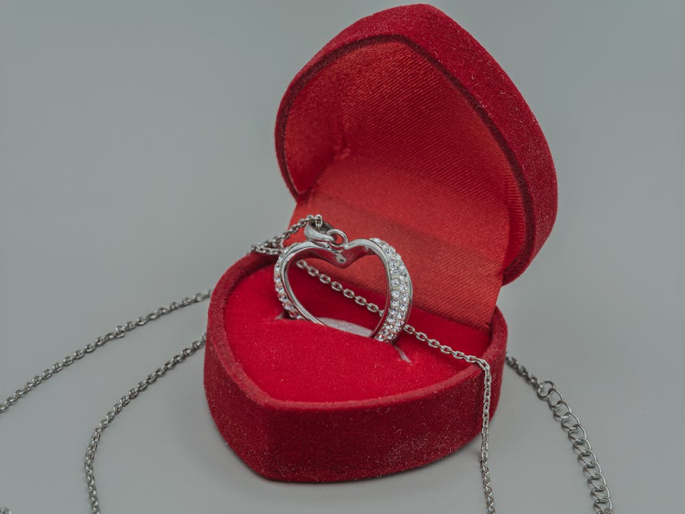 Free Heart Shaped Locket in a Red Box Stock Photo