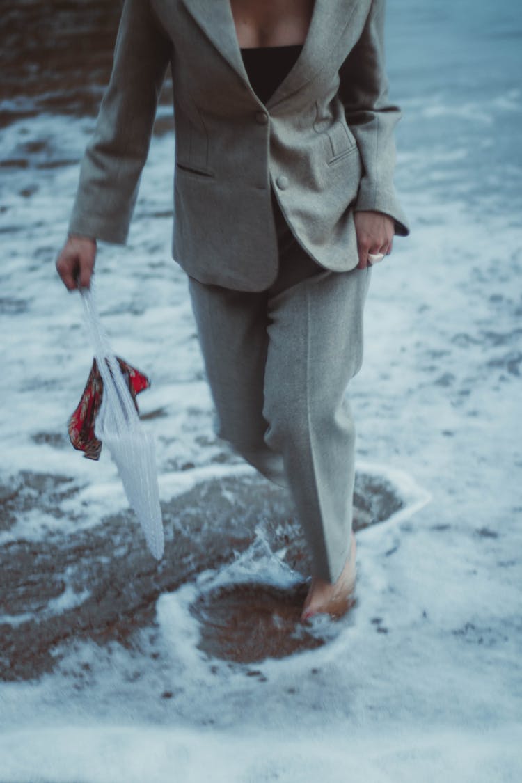 Woman Walking In Snow