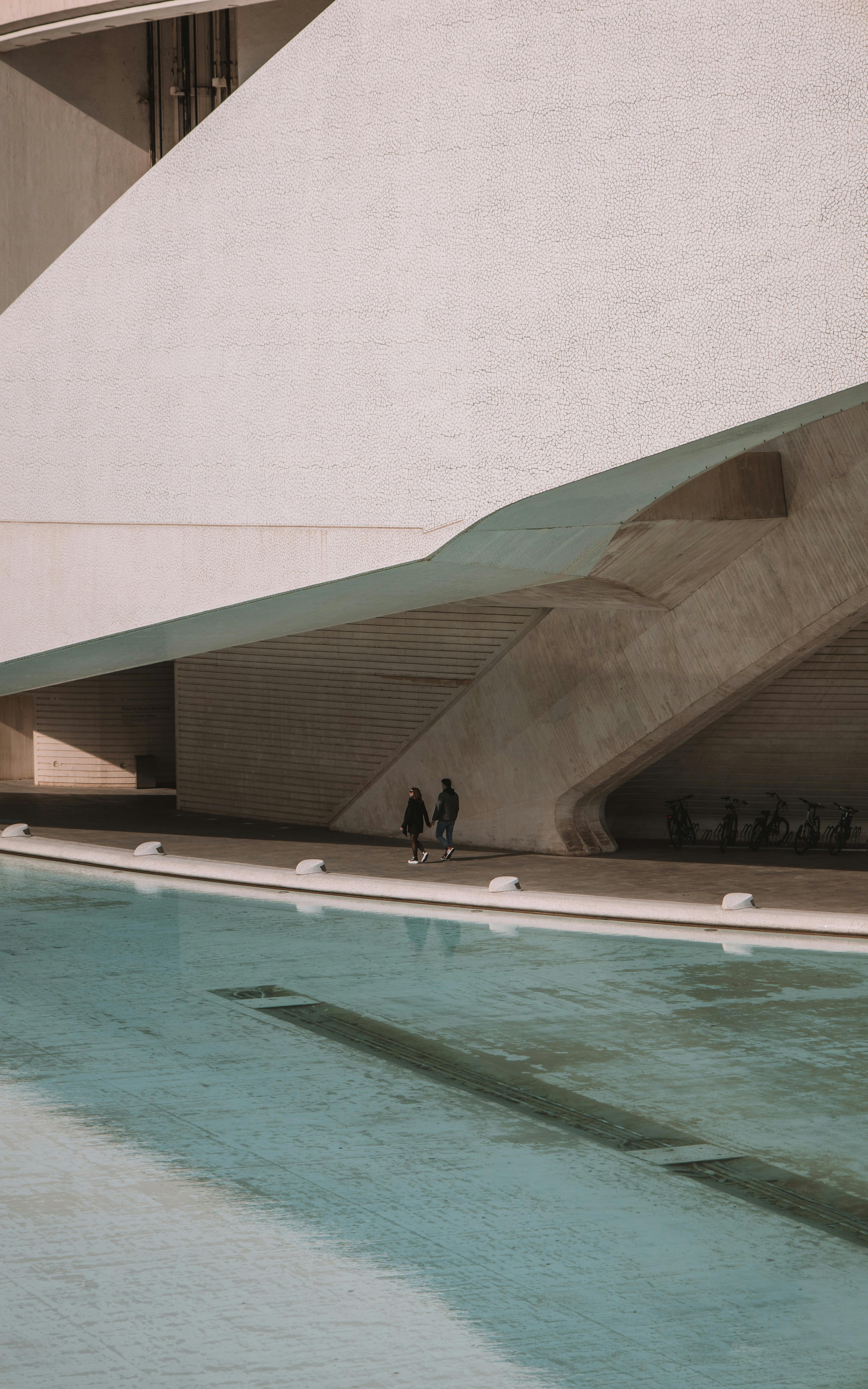 Contemporary architecture with a sleek facade and water reflection in Valencia, Spain.