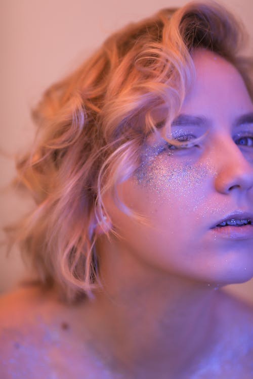 Blonde Woman with Glitter on Face