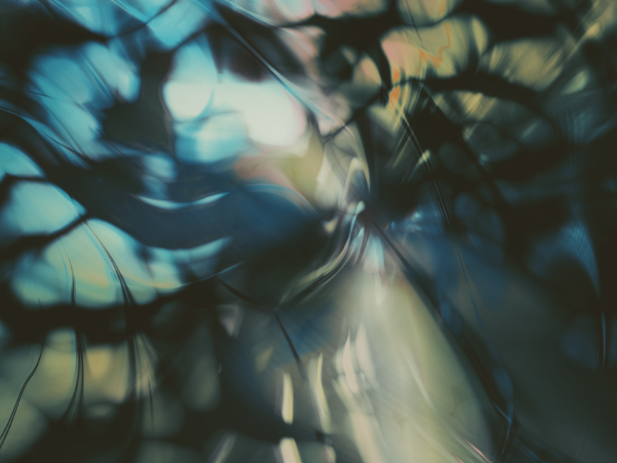 Abstract image with fluid texture and pastel colors, creating a dreamy, distorted effect.