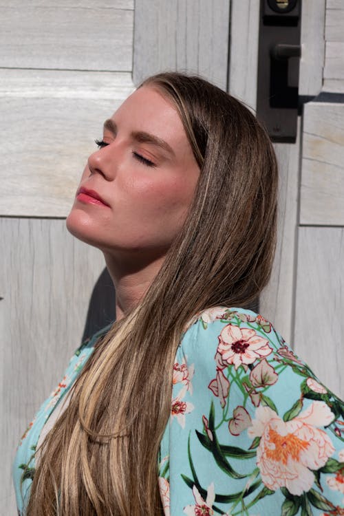 Portrait of Woman with Long Hair and Eyes Closed