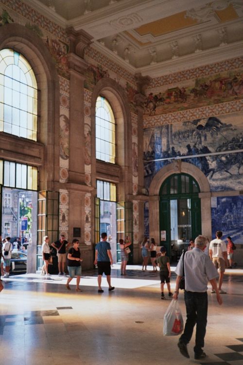Free Sunlit interior of São Bento Station in Porto, Portugal, showcasing its historic architecture. Stock Photo